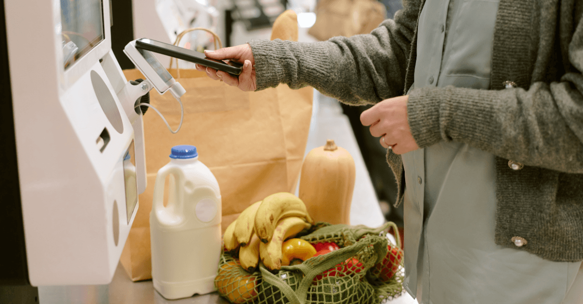 Lady with shopping at self serve till