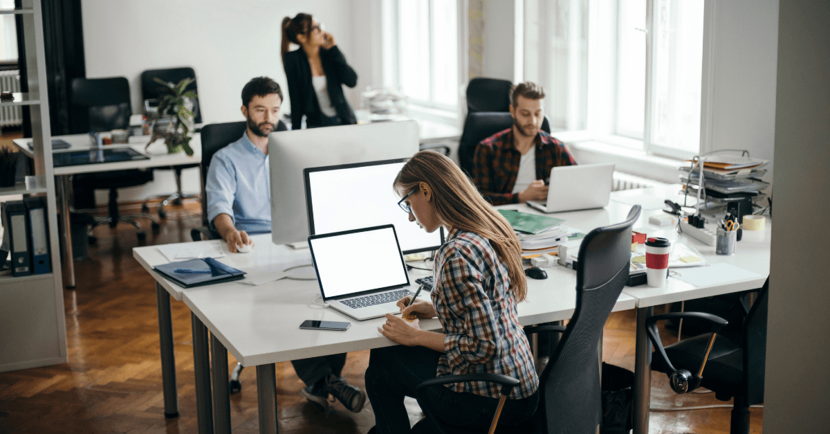 People working in office space on devices